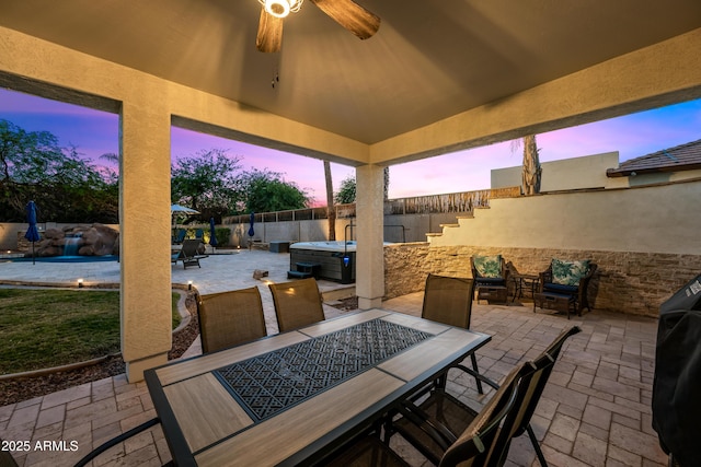 patio terrace at dusk with ceiling fan