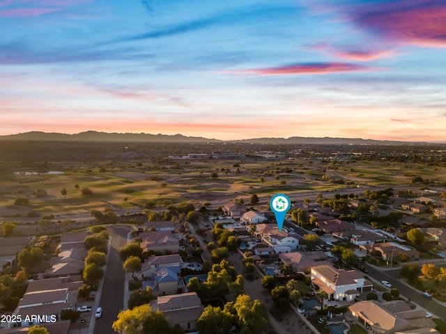 aerial view at dusk with a mountain view