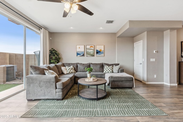2237 S Jacana Ln, Gilbert, AZ 85295 - living room with wood finished floors, a ceiling fan, baseboards, and recessed lighting