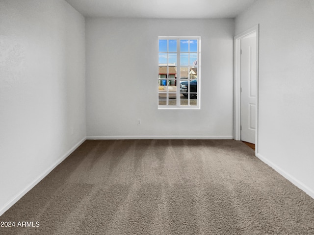 unfurnished room with carpet floors