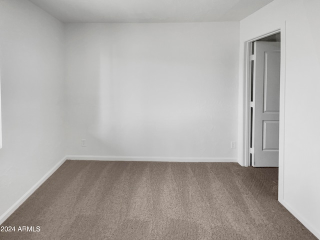 unfurnished room with carpet floors