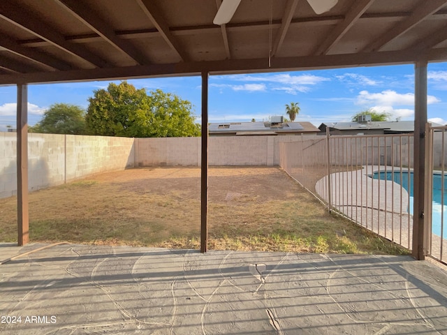 view of patio with a fenced in pool