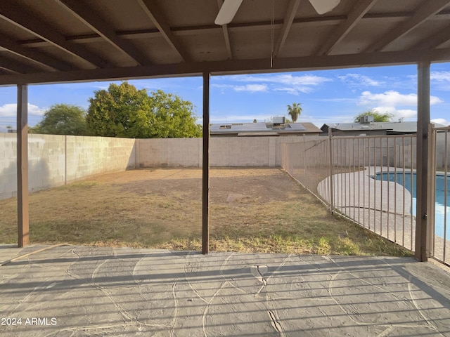 view of yard with a fenced in pool and a patio area