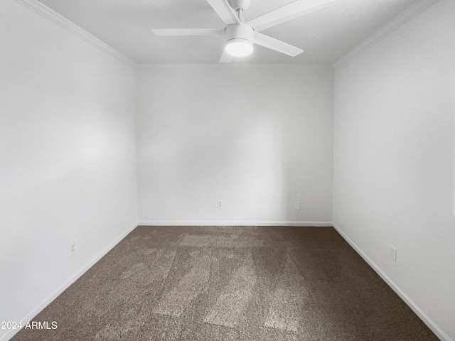 carpeted spare room with crown molding and ceiling fan