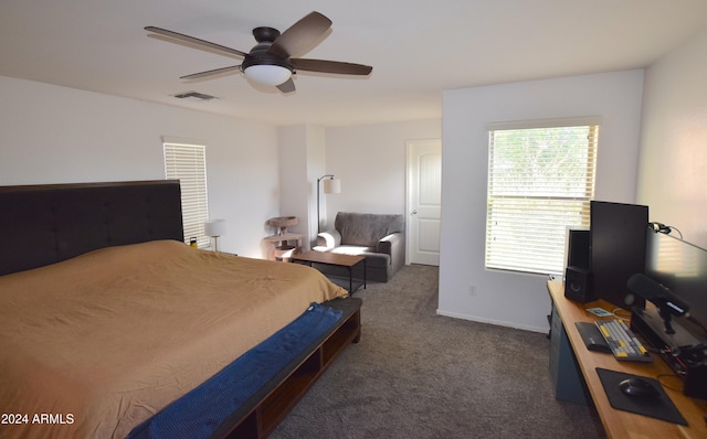 bedroom featuring ceiling fan and dark colored carpet