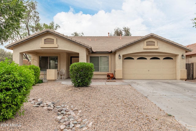 ranch-style home with a garage