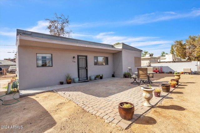 rear view of house with a patio