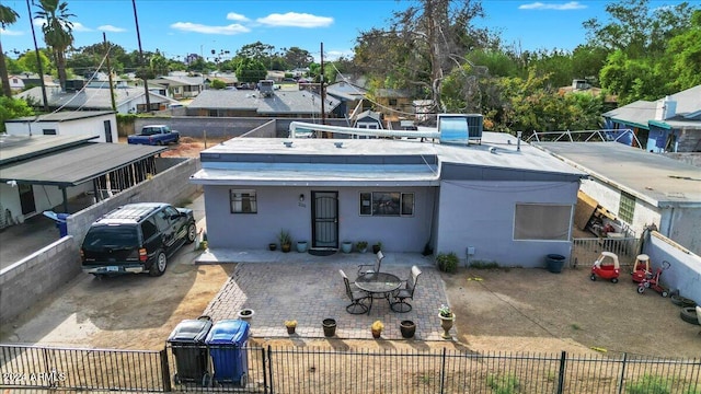 rear view of house with a carport