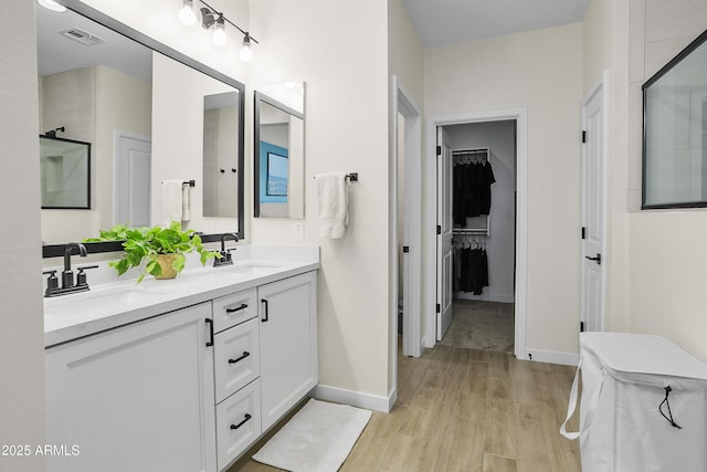 bathroom featuring hardwood / wood-style flooring and vanity