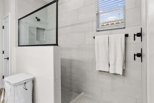 bathroom with tiled shower