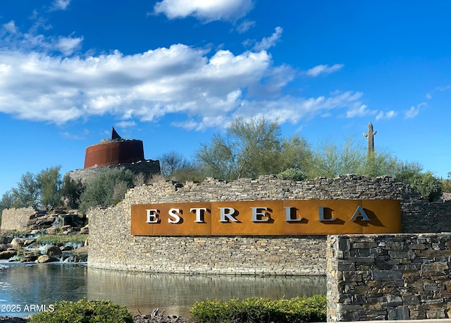 community sign with a water view