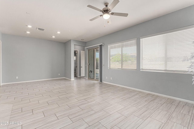 empty room featuring baseboards, a ceiling fan, recessed lighting, and visible vents