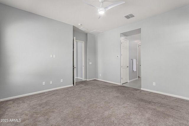 unfurnished bedroom featuring baseboards, ceiling fan, carpet, and visible vents