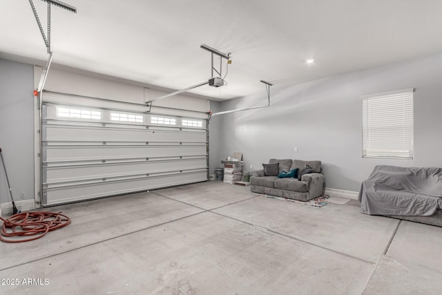 garage featuring baseboards and a garage door opener