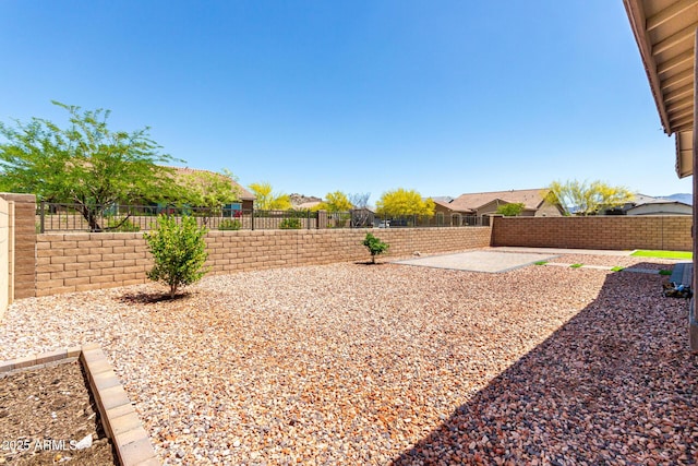 view of yard with a patio and a fenced backyard
