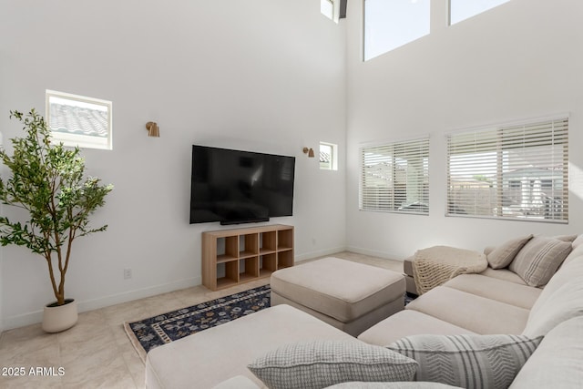 5330 W Thresher Way, Laveen, AZ 85339 - living room featuring a high ceiling and baseboards