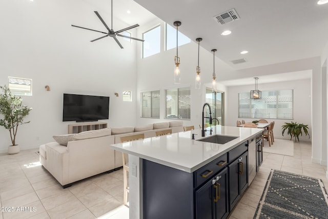 5330 W Thresher Way, Laveen, AZ 85339 - kitchen with a sink, healthy amount of natural light, light tile patterned flooring, a ceiling fan, and a high ceiling