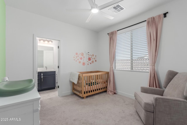 5330 W Thresher Way, Laveen, AZ 85339 - bedroom with light carpet, a sink, baseboards, and a nursery area