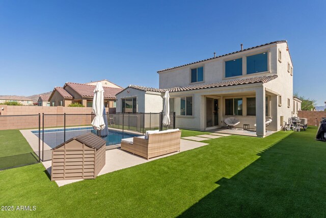 5330 W Thresher Way, Laveen, AZ 85339 - back of property with stucco siding, an outdoor living space, a patio area, and a tiled roof