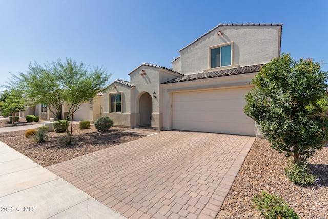 5330 W Thresher Way, Laveen, AZ 85339 - mediterranean / spanish-style home featuring a tiled roof, decorative driveway, and stucco siding