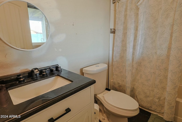 full bathroom featuring vanity, shower / bath combination with curtain, and toilet