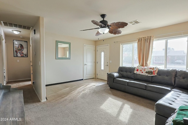 living room with light colored carpet and ceiling fan