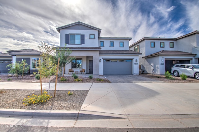 view of front of home with a garage and a porch