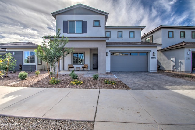 view of front of property with a garage and a porch