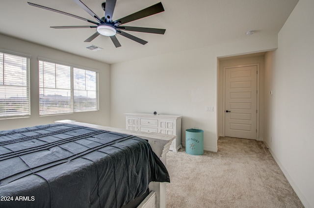 bedroom with ceiling fan and light colored carpet