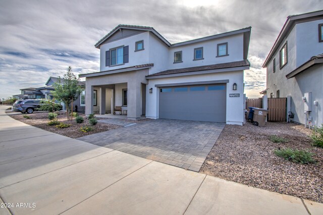 view of front of house with a garage and a porch