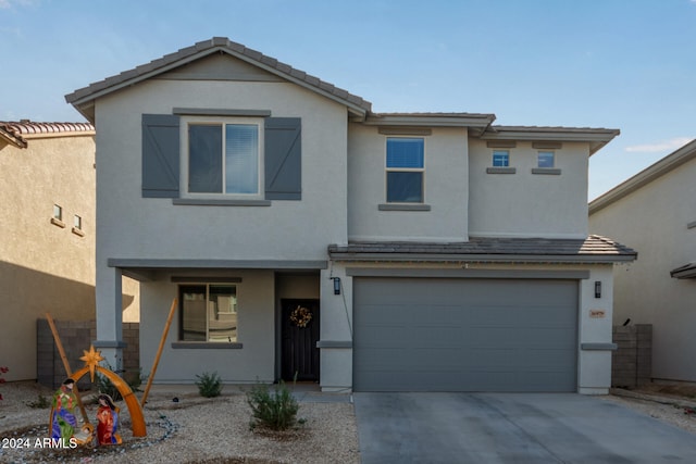 view of front of property with a garage