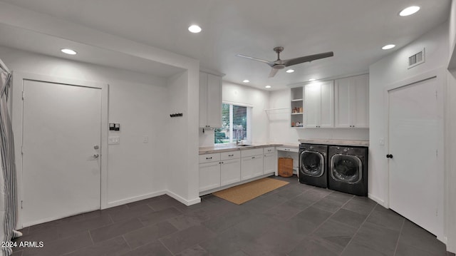 washroom with ceiling fan, cabinets, and independent washer and dryer