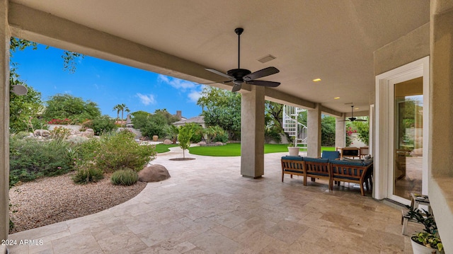 view of patio / terrace featuring an outdoor living space and ceiling fan