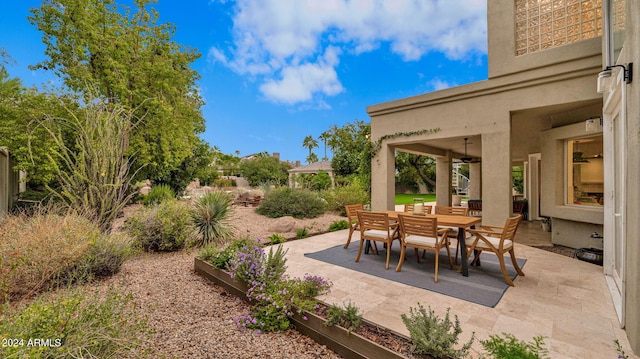 view of patio featuring ceiling fan