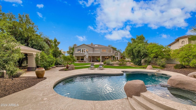 view of swimming pool with a patio