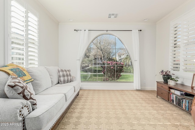 living room featuring crown molding