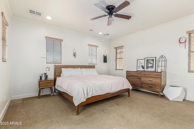 bedroom with ceiling fan, light colored carpet, and ornamental molding