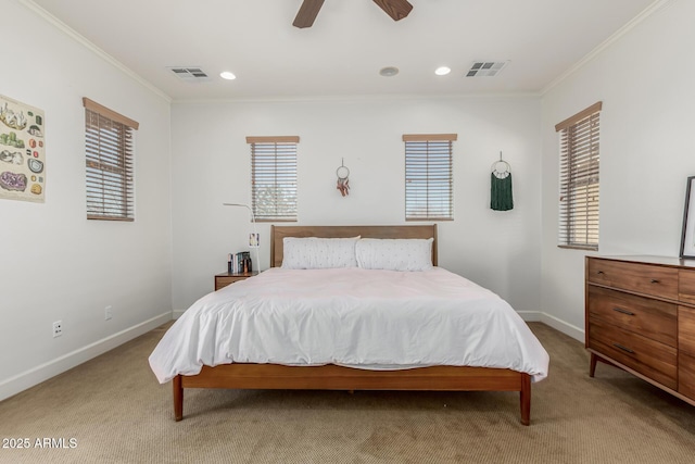 carpeted bedroom featuring ceiling fan and crown molding