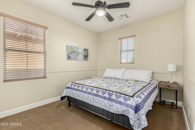 bedroom featuring ceiling fan and dark colored carpet