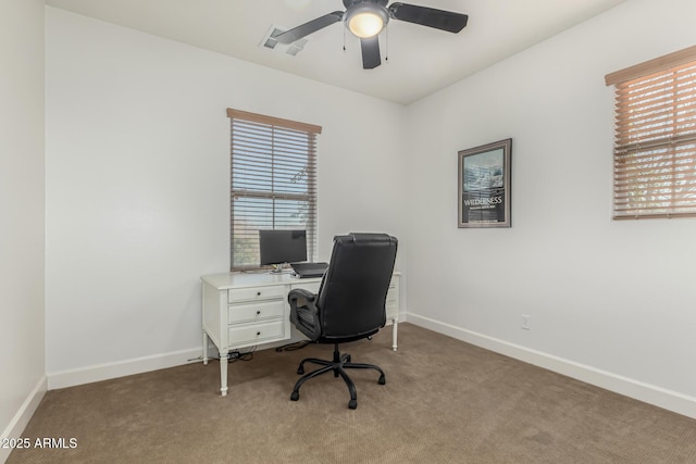 home office with ceiling fan and light colored carpet