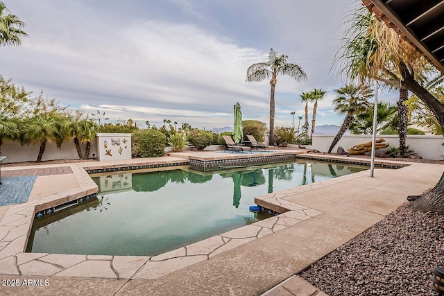 pool with a patio area