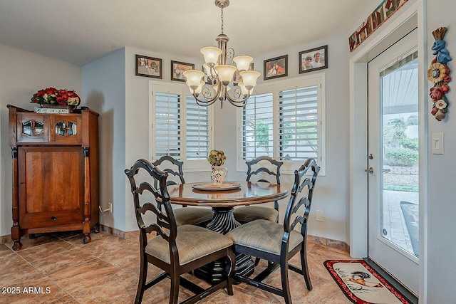 dining space featuring a notable chandelier