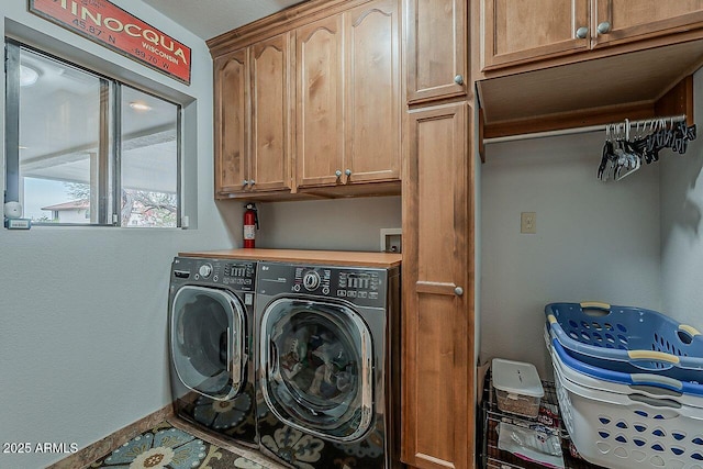 laundry area with cabinet space and washing machine and clothes dryer