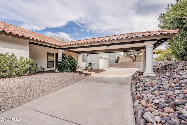 exterior space with concrete driveway