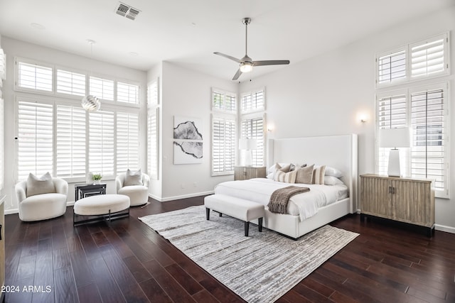 bedroom featuring ceiling fan and dark hardwood / wood-style floors