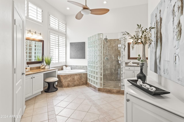 bathroom featuring tile patterned floors, vanity, ceiling fan, and plus walk in shower