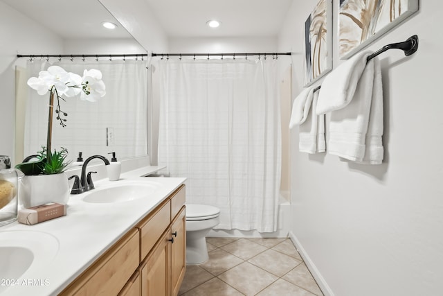 full bathroom featuring tile patterned floors, vanity, toilet, and shower / bath combo with shower curtain