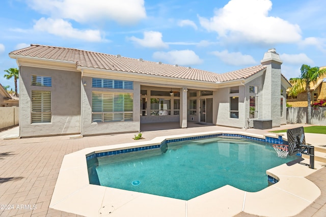 back of property with a patio