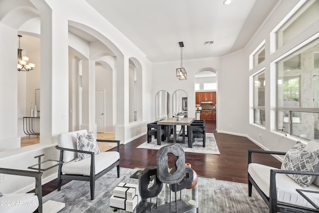 living room featuring dark hardwood / wood-style floors and a chandelier