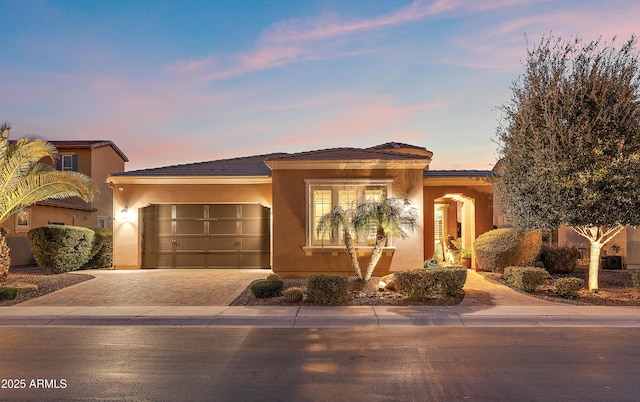 mediterranean / spanish house featuring a garage